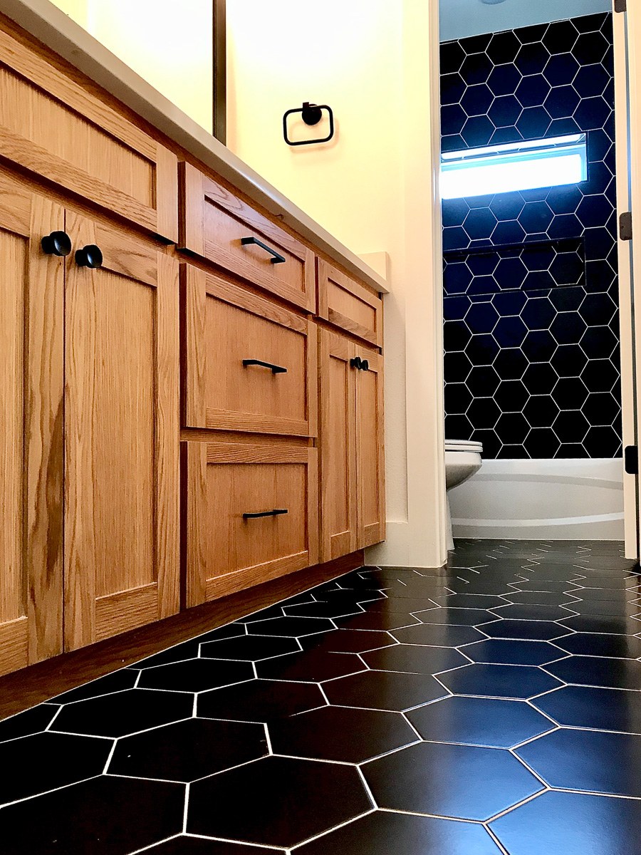 custom geometric bathroom tile floor and wall installed by Floored by Barrett in the Temple Belton area