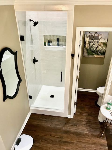 Small white tile shower with shower shelf installed by Floored by Barrett in the Temple Belton area