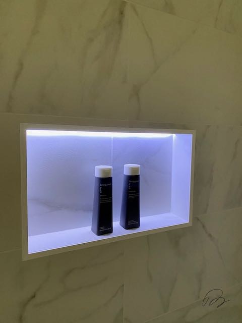 Marble Tile Shower Shelf with lighting / Lights with Soap installed by Floored by Barrett in the Temple Belton area