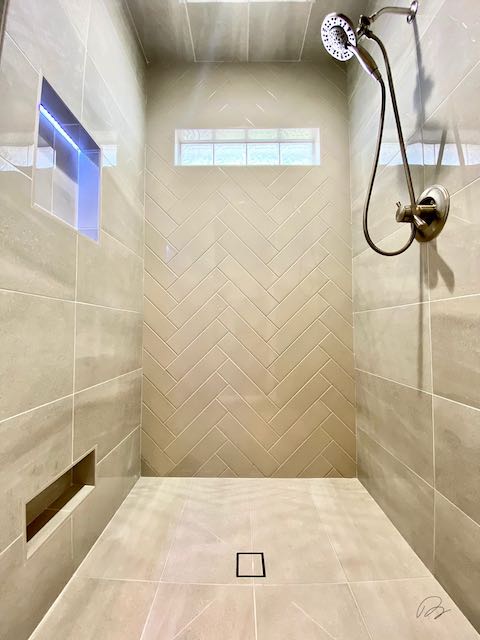 Grey Tile Shower that has shelf with lighting / lights installed by Floored by Barrett in the Temple Belton area